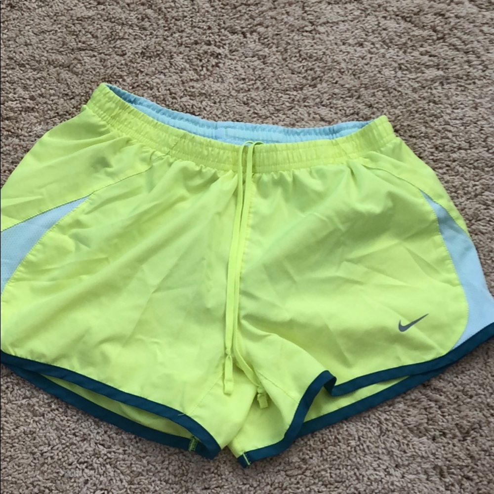 Bright yellow Nike running shorts